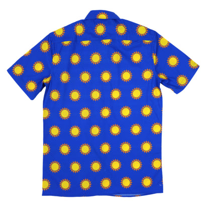 Blue shirt with yellow sun pattern on a white background