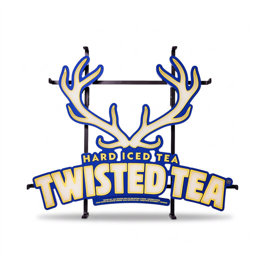 Twisted Tea Hard Iced Tea sign on a black metal stand, featuring a large cream antler graphic and bold yellow lettering outlined in blue on a white background.
