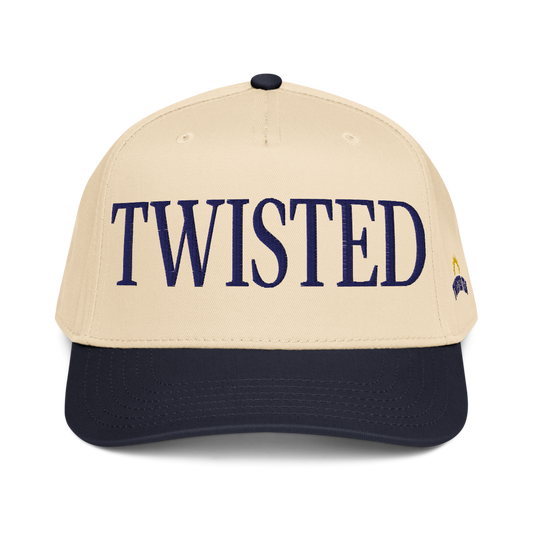 Twisted Tea baseball cap with cream crown and navy brim, featuring embroidered navy “Twisted” lettering on the front panel.