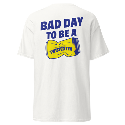 White short-sleeve t-shirt shown from the back, featuring a bold graphic print in blue and yellow. The graphic reads 'BAD DAY TO BE A' above a yellow can-shaped design with 'TWISTED TEA' written on it.