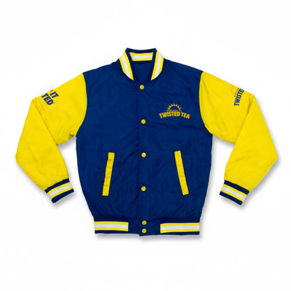 A varsity-style jacket with a navy blue body and bright yellow sleeves, featuring yellow buttons, ribbed navy and yellow striped collar, cuffs, and hem. The chest displays 'TWISTED TEA' with a sun graphic, and the sleeves show additional text.