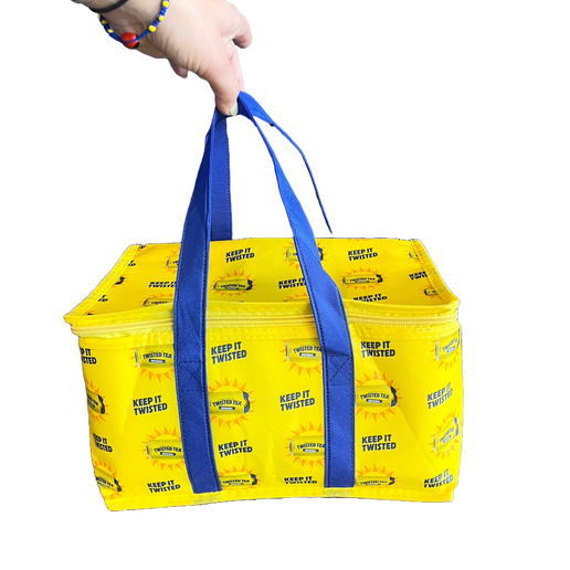 Close-up of yellow soft cooler bag with blue handles. Cooler is covered in writing "Keep it Twisted", and Twisted Tea cans with sun around them.