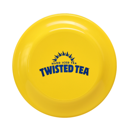 Close-up of yellow frisbee with Twisted Tea logo on it.