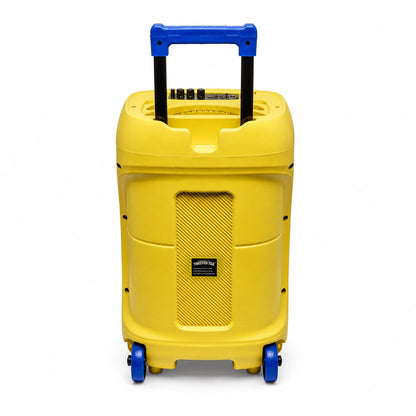 The back view of a yellow rectangular speaker against a white background. There is a black and blue handle that is pulled up. Four black buttons can be seen. There is a small black rectangle in the middle of the speaker that has "Twisted Tea" written in white. Two blue wheels can be seen.